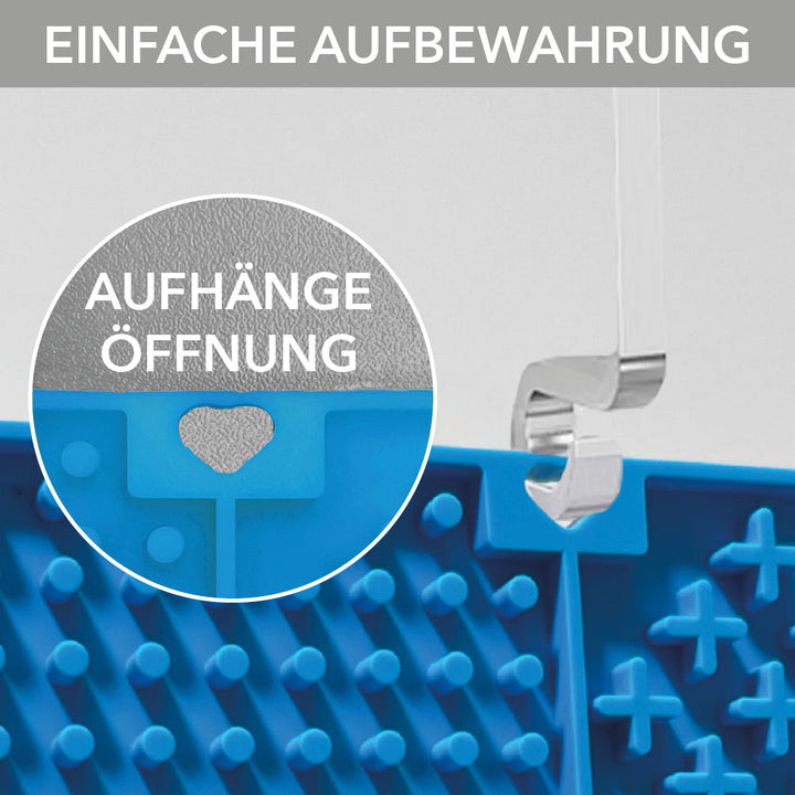 Aufhängeöffnung in Herzform am Rand der entoVITAL Schleckmatte, an einem Haken aufgehängt